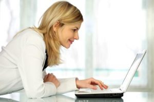 woman looking at laptop